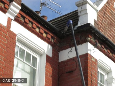 Expert gutter cleaning in action